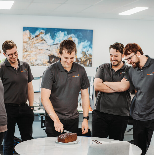 techbrain team, cutting cake, celebrating