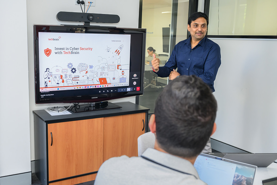 Ashish Srivastava presenting in a cyber security strategy meeting